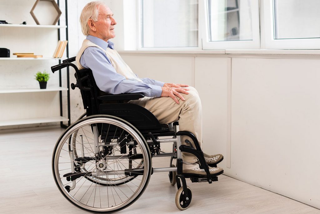 side view old man sitting wheelchair